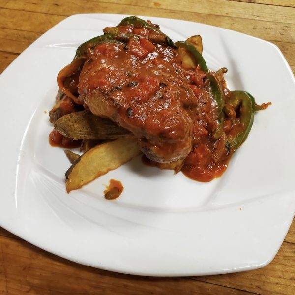12 oz ny strip steak pan seared with peppers, onions, and oregano with marinara, served with steak fries