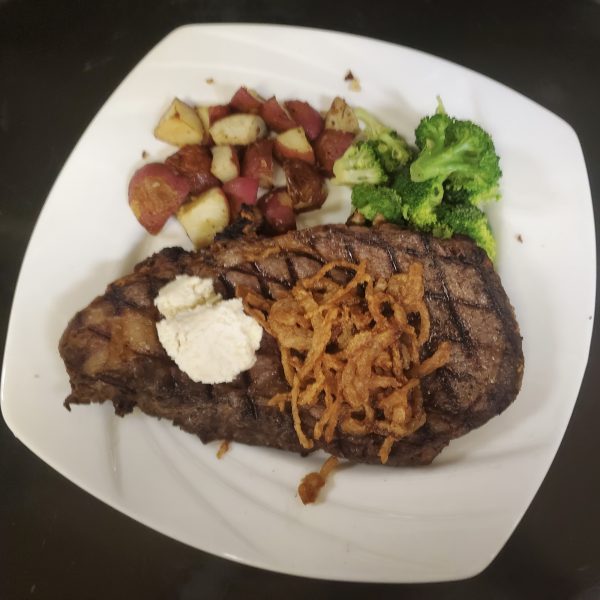 12 oz. ribeye served with roasted potatoes and vegetable