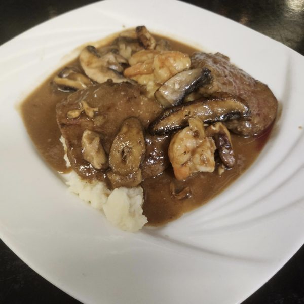 medallions of filet and shrimp sautéed in sherry marsala sauce with wild mushrooms over garlic mashed potatoes