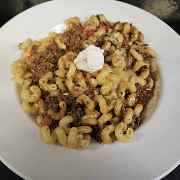 cavatappi pasta with seasoned ground beef, salsa, taco seasoning, sour cream, and melted cheddar cheese