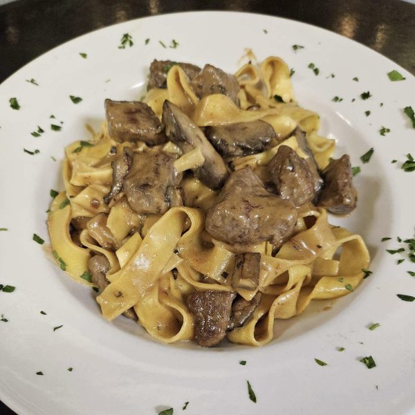 tenderloin tips sautéed with mushrooms, sour cream, and a demi-glace, tossed with egg noodle